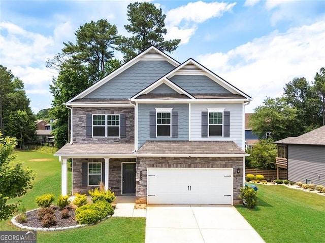 3390 Meadow Grass Dr, Dacula, GA 30019 - craftsman inspired home with stone siding, driveway, a front lawn, a garage, and a porch