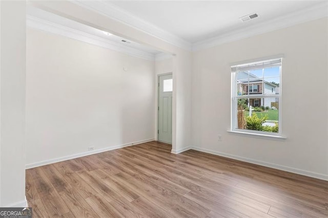 3390 Meadow Grass Dr, Dacula, GA 30019 - empty room featuring ornamental molding and light wood finished floors