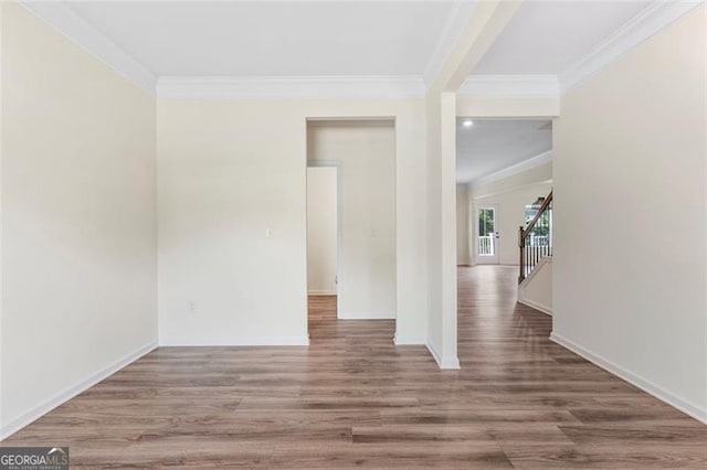 3390 Meadow Grass Dr, Dacula, GA 30019 - empty room with ornamental molding, wood finished floors, and stairs