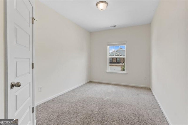 3390 Meadow Grass Dr, Dacula, GA 30019 - spare room featuring light carpet and baseboards