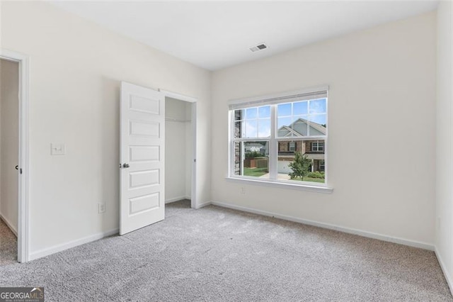 3390 Meadow Grass Dr, Dacula, GA 30019 - unfurnished bedroom with carpet and a closet