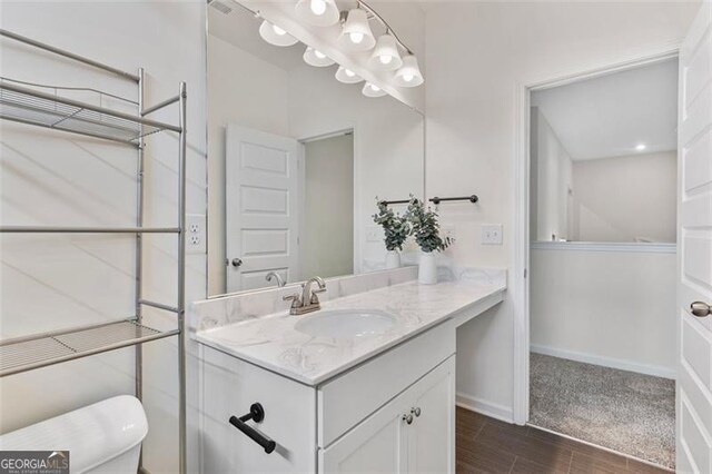 3390 Meadow Grass Dr, Dacula, GA 30019 - bathroom with vanity and wood finished floors