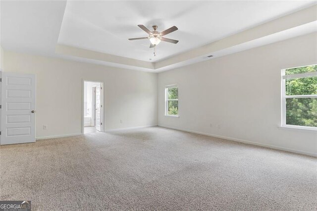 3390 Meadow Grass Dr, Dacula, GA 30019 - empty room with ceiling fan, a raised ceiling, and light colored carpet