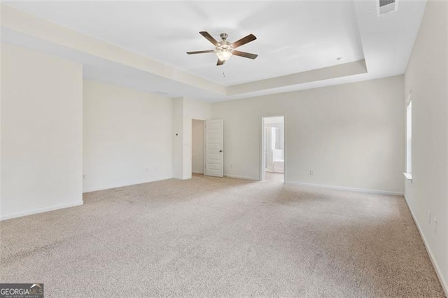 3390 Meadow Grass Dr, Dacula, GA 30019 - unfurnished room with ceiling fan, light colored carpet, and a raised ceiling