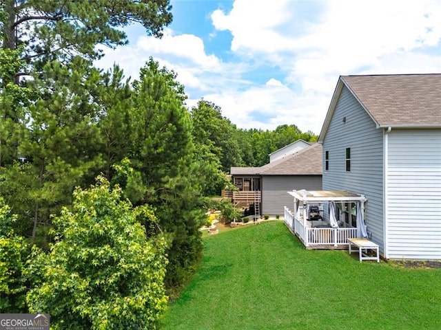3390 Meadow Grass Dr, Dacula, GA 30019 - view of green lawn with a deck