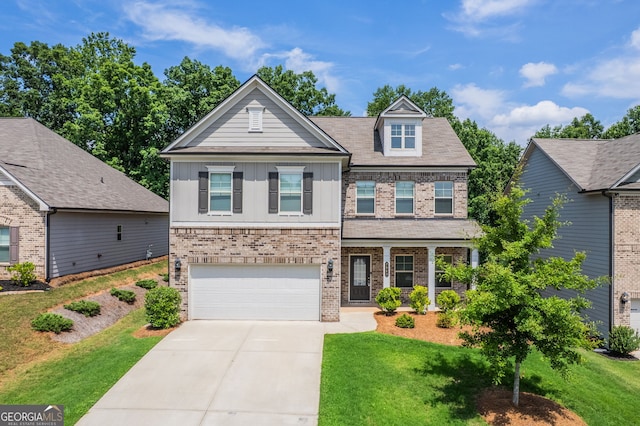 7043 Lancaster Xing, Flowery Branch, GA 30542 - craftsman inspired home with brick siding, a front lawn, and concrete driveway