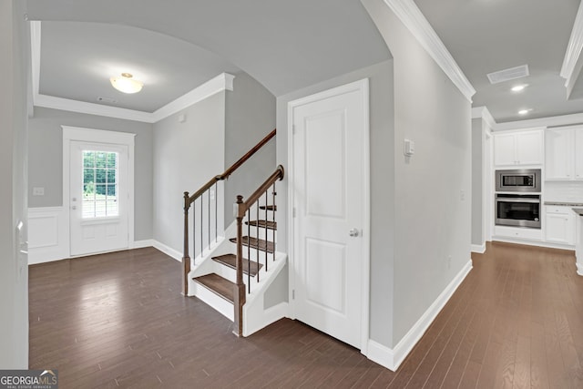 7043 Lancaster Xing, Flowery Branch, GA 30542 - entryway featuring crown molding, dark wood-style floors, stairs, and recessed lighting