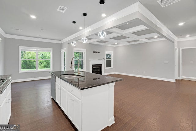 7043 Lancaster Xing, Flowery Branch, GA 30542 - kitchen with open floor plan, dark wood-style flooring, dishwasher, a fireplace, and dark stone counters