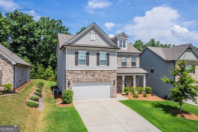 7043 Lancaster Xing, Flowery Branch, GA 30542 - craftsman-style home featuring board and batten siding, concrete driveway, a garage, and a front yard