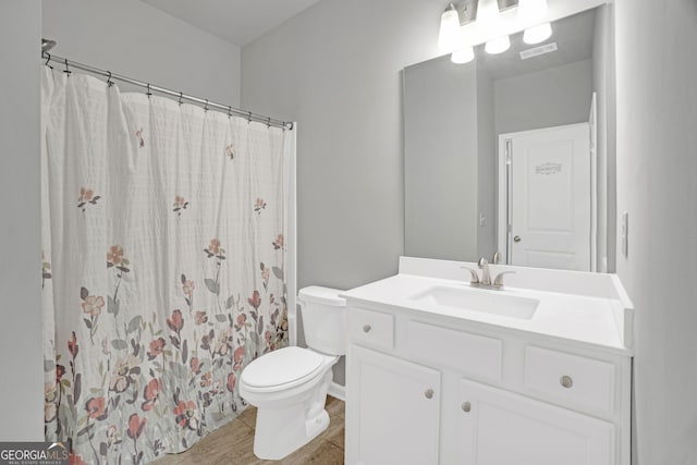 7043 Lancaster Xing, Flowery Branch, GA 30542 - bathroom with vanity, wood finished floors, and a shower with curtain