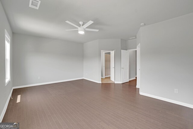 7043 Lancaster Xing, Flowery Branch, GA 30542 - spare room with ceiling fan and dark wood-style flooring