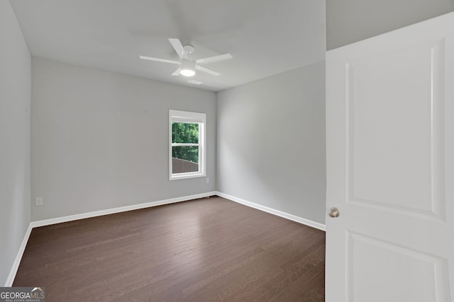 7043 Lancaster Xing, Flowery Branch, GA 30542 - unfurnished room featuring dark wood-style flooring and ceiling fan