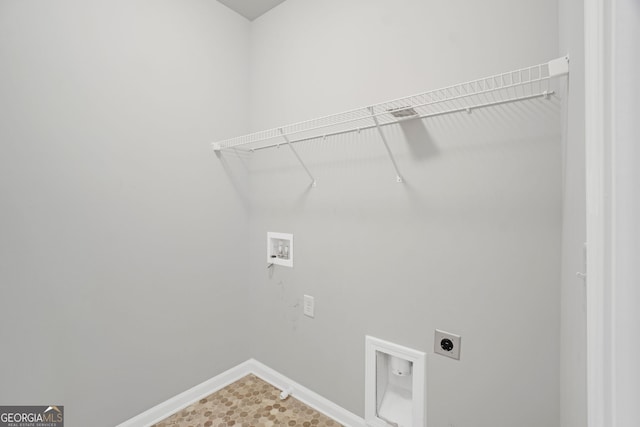 7043 Lancaster Xing, Flowery Branch, GA 30542 - laundry room featuring hookup for an electric dryer and hookup for a washing machine