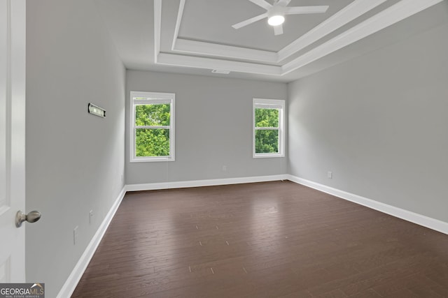 7043 Lancaster Xing, Flowery Branch, GA 30542 - unfurnished room featuring a raised ceiling, ceiling fan, dark wood-style floors, and crown molding