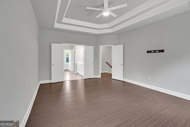 7043 Lancaster Xing, Flowery Branch, GA 30542 - unfurnished room featuring a tray ceiling, a ceiling fan, dark wood finished floors, and crown molding