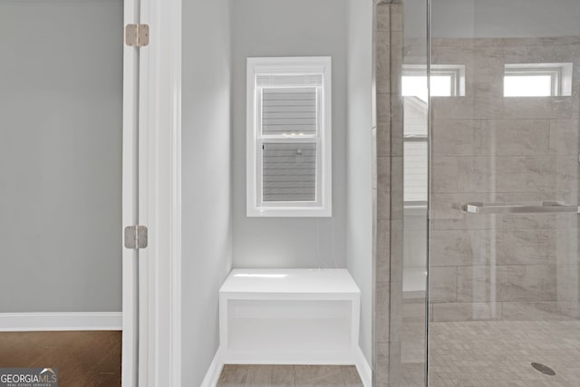 7043 Lancaster Xing, Flowery Branch, GA 30542 - bathroom with a stall shower and baseboards