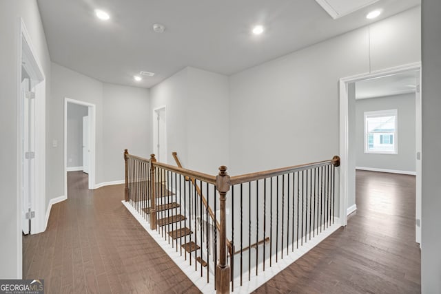 7043 Lancaster Xing, Flowery Branch, GA 30542 - corridor featuring an upstairs landing, wood finished floors, recessed lighting, and attic access