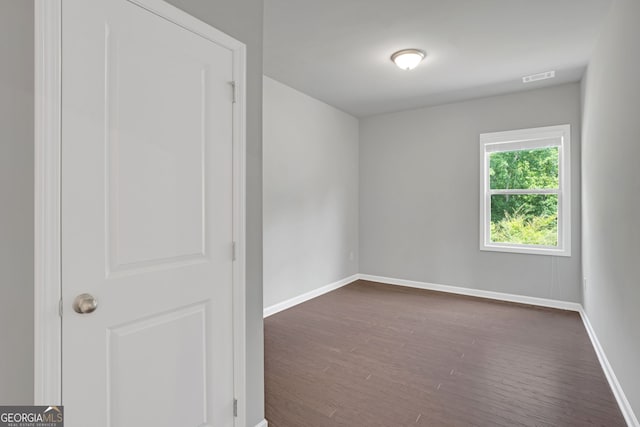 7043 Lancaster Xing, Flowery Branch, GA 30542 - unfurnished room featuring dark wood-style floors