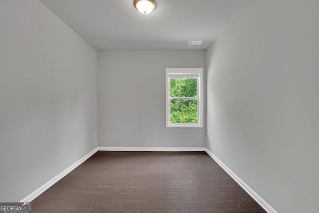 7043 Lancaster Xing, Flowery Branch, GA 30542 - empty room with dark wood-style flooring and baseboards