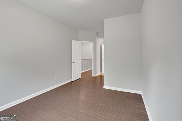 7043 Lancaster Xing, Flowery Branch, GA 30542 - unfurnished room featuring wood finished floors and baseboards