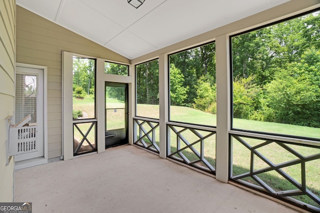 7043 Lancaster Xing, Flowery Branch, GA 30542 - unfurnished sunroom featuring vaulted ceiling