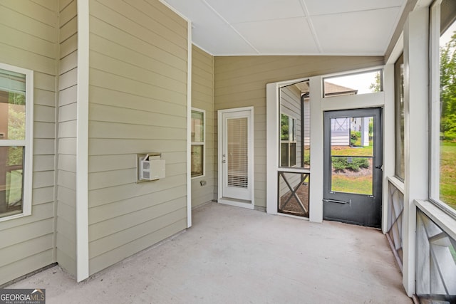 7043 Lancaster Xing, Flowery Branch, GA 30542 - unfurnished sunroom with lofted ceiling and healthy amount of natural light