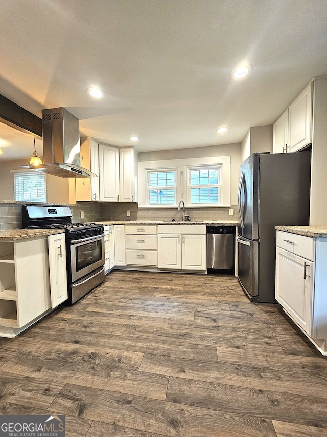 1341 SE Joyner Ave SE, Marietta, GA 30060 - kitchen featuring appliances with stainless steel finishes, island range hood, white cabinetry, dark wood-style flooring, and recessed lighting