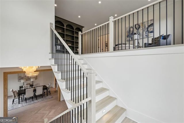 1312 Becket Dr NE, Brookhaven, GA 30319 - staircase with a chandelier and recessed lighting