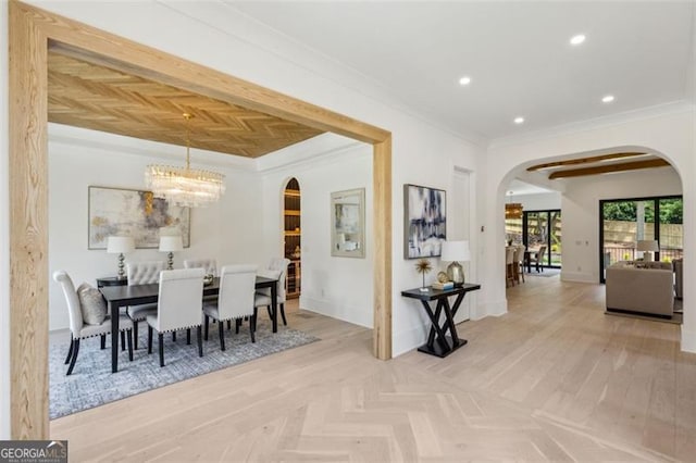 1312 Becket Dr NE, Brookhaven, GA 30319 - dining space featuring arched walkways, ornamental molding, a chandelier, and recessed lighting