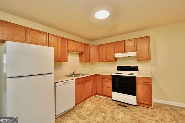 1824 Cedar Shoals Dr, Athens, GA 30605 - kitchen featuring white appliances, under cabinet range hood, and light countertops