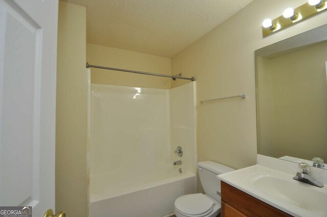 1824 Cedar Shoals Dr, Athens, GA 30605 - bathroom featuring a textured ceiling, vanity, and washtub / shower combination