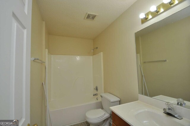 1824 Cedar Shoals Dr, Athens, GA 30605 - full bathroom with vanity, shower / washtub combination, and a textured ceiling