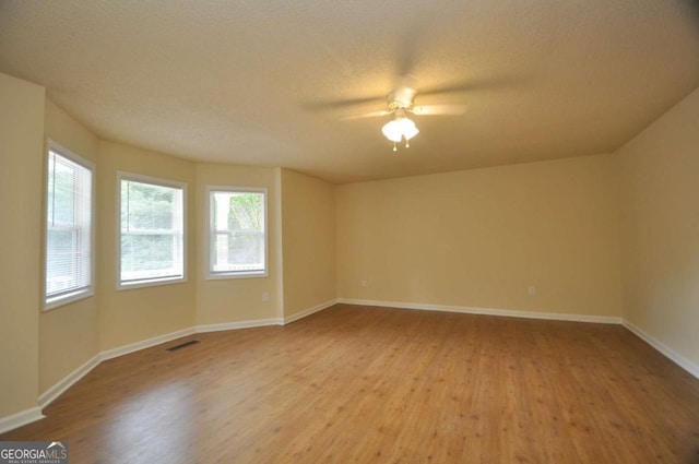 1824 Cedar Shoals Dr, Athens, GA 30605 - spare room with healthy amount of natural light, wood finished floors, and ceiling fan