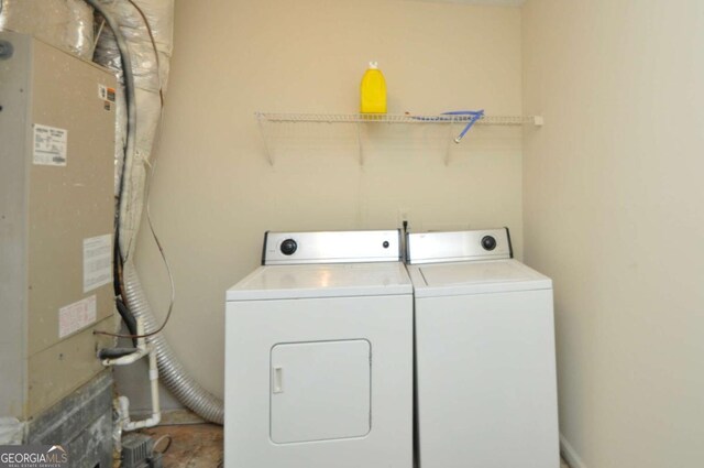 1824 Cedar Shoals Dr, Athens, GA 30605 - laundry room featuring separate washer and dryer and heating unit
