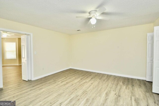 1824 Cedar Shoals Dr, Athens, GA 30605 - spare room featuring ceiling fan, light wood finished floors, and a textured ceiling