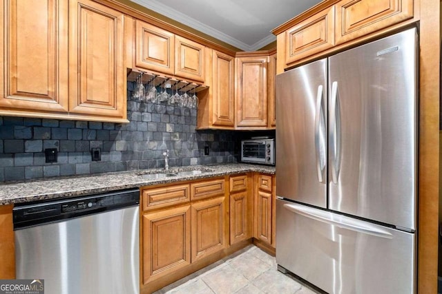 3071 Lenox Rd NE Unit 19, Atlanta, GA 30324 - kitchen featuring stainless steel appliances, dark stone counters, decorative backsplash, crown molding, and light tile patterned floors