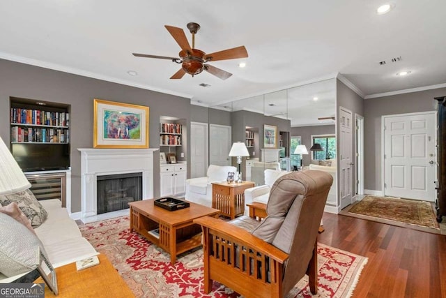 3071 Lenox Rd NE Unit 19, Atlanta, GA 30324 - living room with a ceiling fan, recessed lighting, light wood finished floors, ornamental molding, and a fireplace