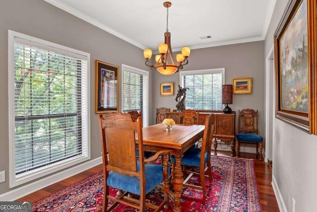 3071 Lenox Rd NE Unit 19, Atlanta, GA 30324 - dining room featuring a chandelier, wood finished floors, and crown molding