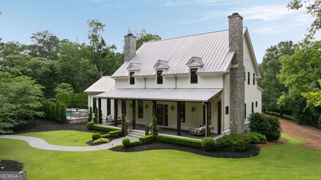 13365 Hopewell Rd, Alpharetta, GA 30004 - view of front facade with a chimney, a porch, and a front lawn
