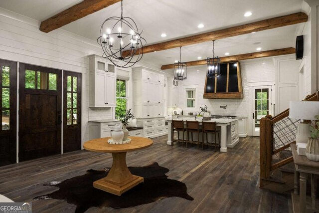 13365 Hopewell Rd, Alpharetta, GA 30004 - dining area with beamed ceiling, dark wood-style floors, healthy amount of natural light, a chandelier, and recessed lighting