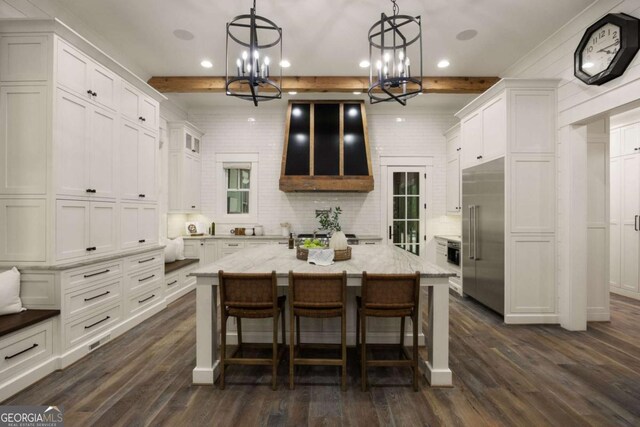 13365 Hopewell Rd, Alpharetta, GA 30004 - kitchen with stainless steel built in fridge, a chandelier, recessed lighting, white cabinets, and dark wood-style flooring