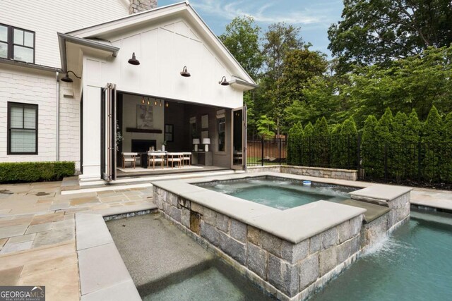 13365 Hopewell Rd, Alpharetta, GA 30004 - view of pool with an in-ground hot tub and an outbuilding