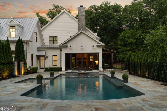 13365 Hopewell Rd, Alpharetta, GA 30004 - view of pool with french doors, a patio area, and a pool with connected hot tub