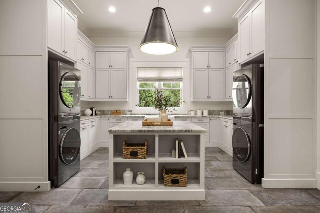 13365 Hopewell Rd, Alpharetta, GA 30004 - laundry room with estacked washer and dryer, recessed lighting, and cabinet space