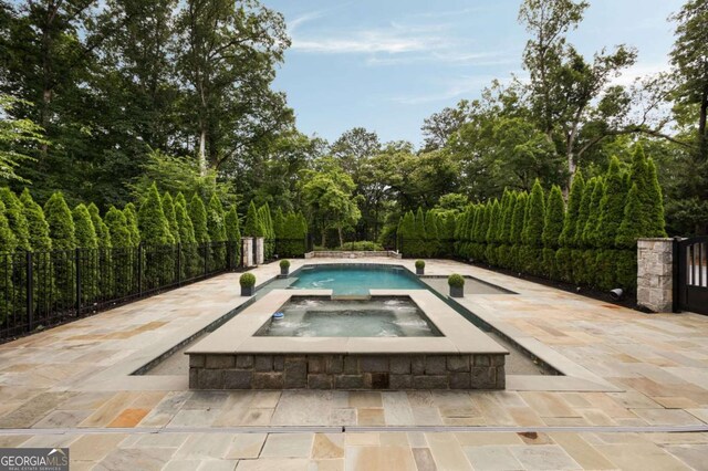 13365 Hopewell Rd, Alpharetta, GA 30004 - view of pool with a patio and a pool with connected hot tub