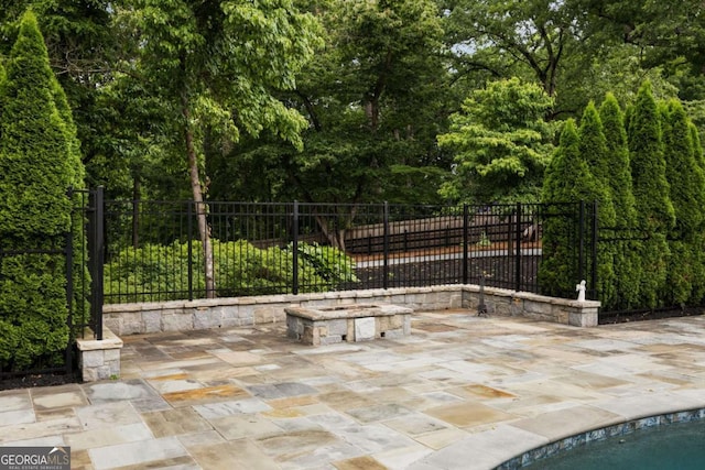 13365 Hopewell Rd, Alpharetta, GA 30004 - view of patio / terrace with an outdoor fire pit