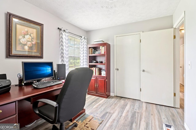 956 Euharlee Rd SW, Cartersville, GA 30120 - home office with a textured ceiling and wood finished floors