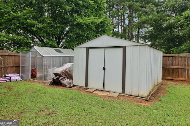 956 Euharlee Rd SW, Cartersville, GA 30120 - view of greenhouse featuring a fenced backyard and a shed