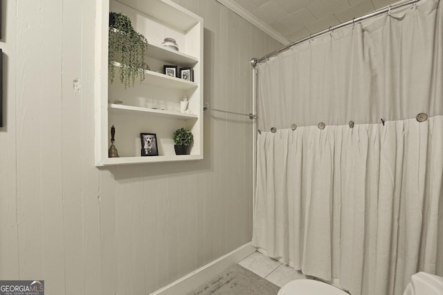 684 Frances Ln, Brooklet, GA 30415 - bathroom with ornamental molding, a shower with shower curtain, and wooden walls