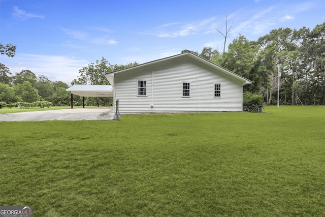 684 Frances Ln, Brooklet, GA 30415 - view of side of home featuring a yard, driveway, and an attached carport